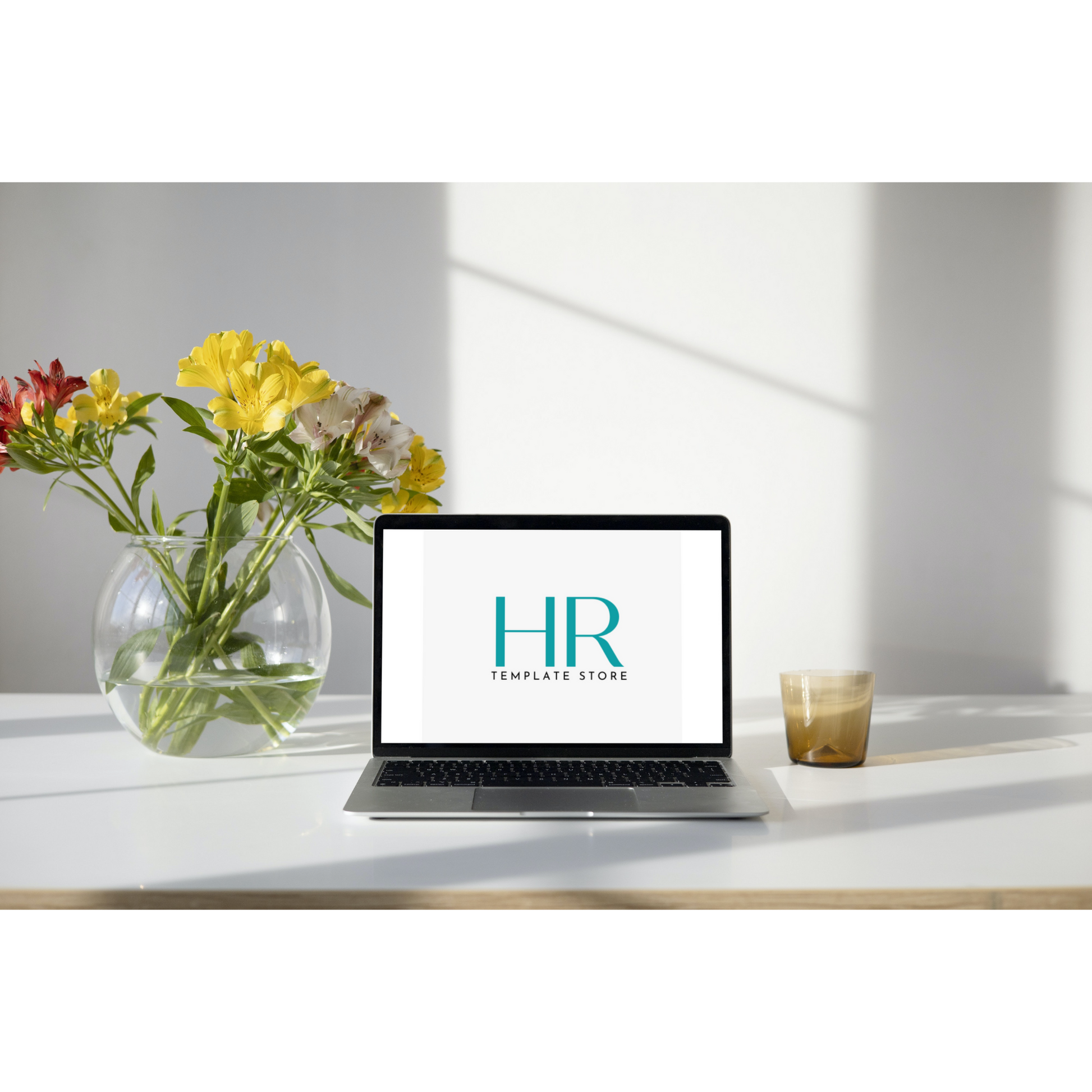 The HR Template Store logo displayed on a laptop placed on a tidy and organized desktop.